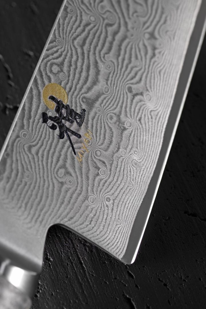 A close-up of the blade of a Miyabi Japanese knife. 