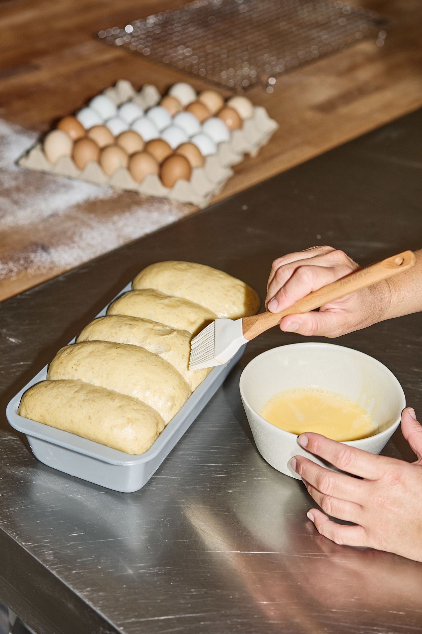 To give the brioche bread the right finish, Lilian brushes it with egg yolk before baking.