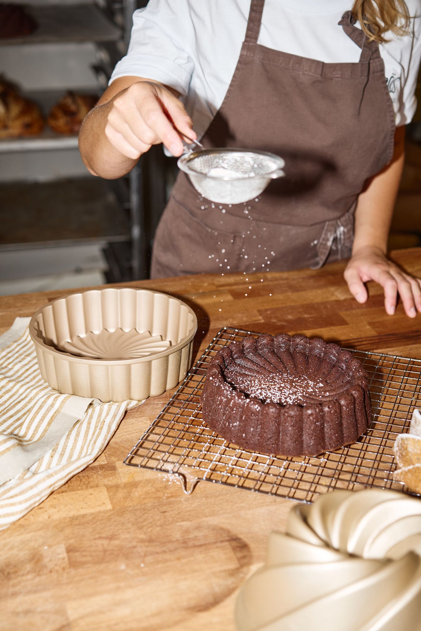 For the perfect finish, Lilian dusts her chocolate cake with icing sugar after it has cooled on a Nordwik rack.